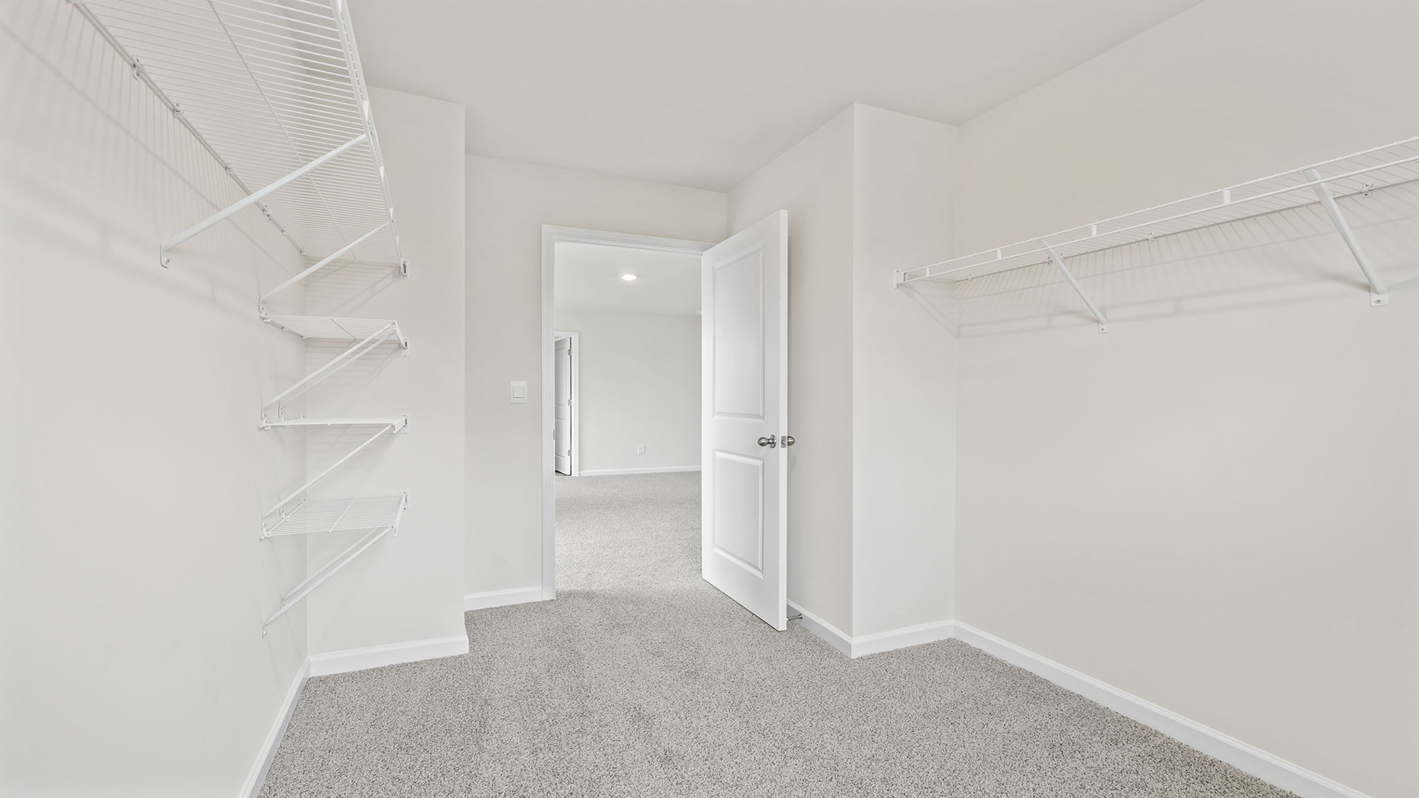 Primary bedroom walk-in closet.