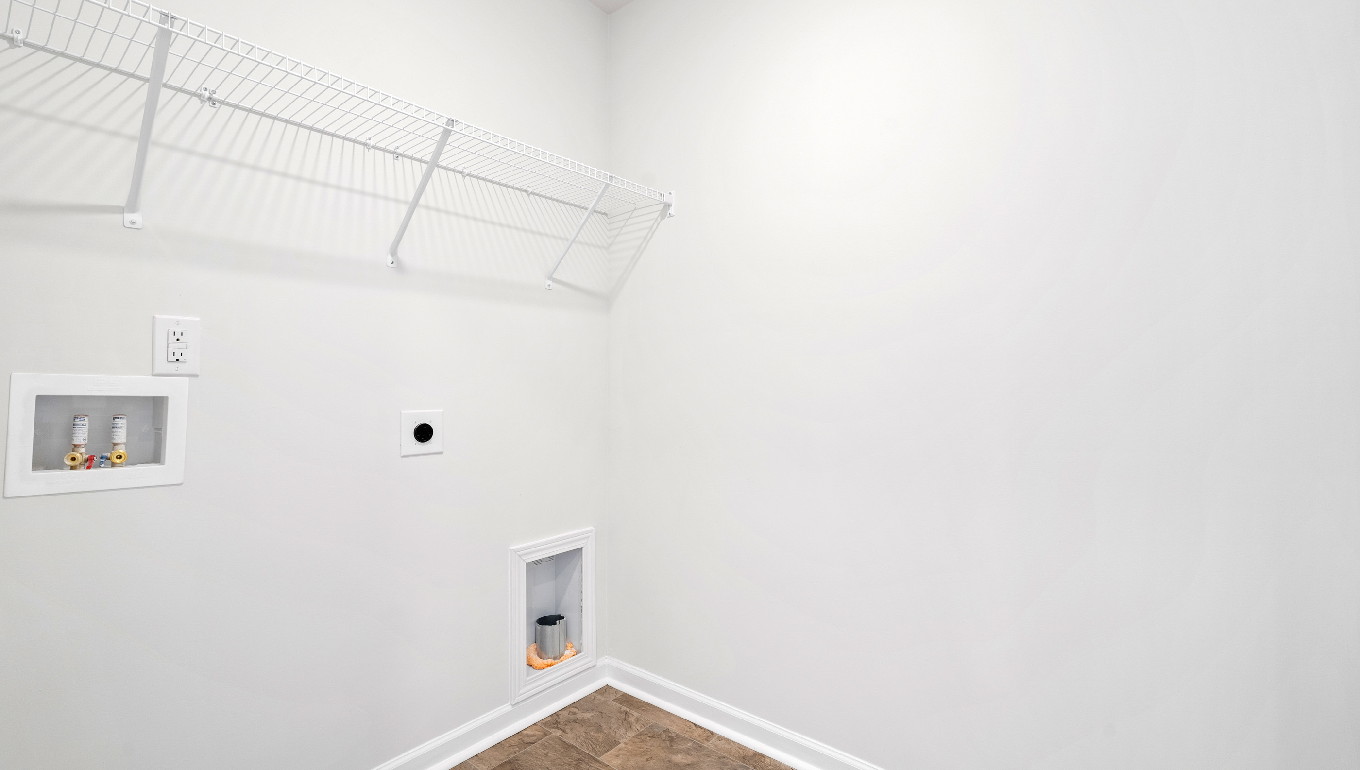 Laundry room with hanging storage racks.