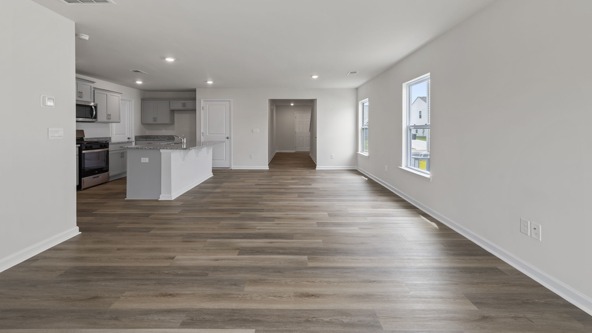 View of open floor plan with combination dining and living areas.