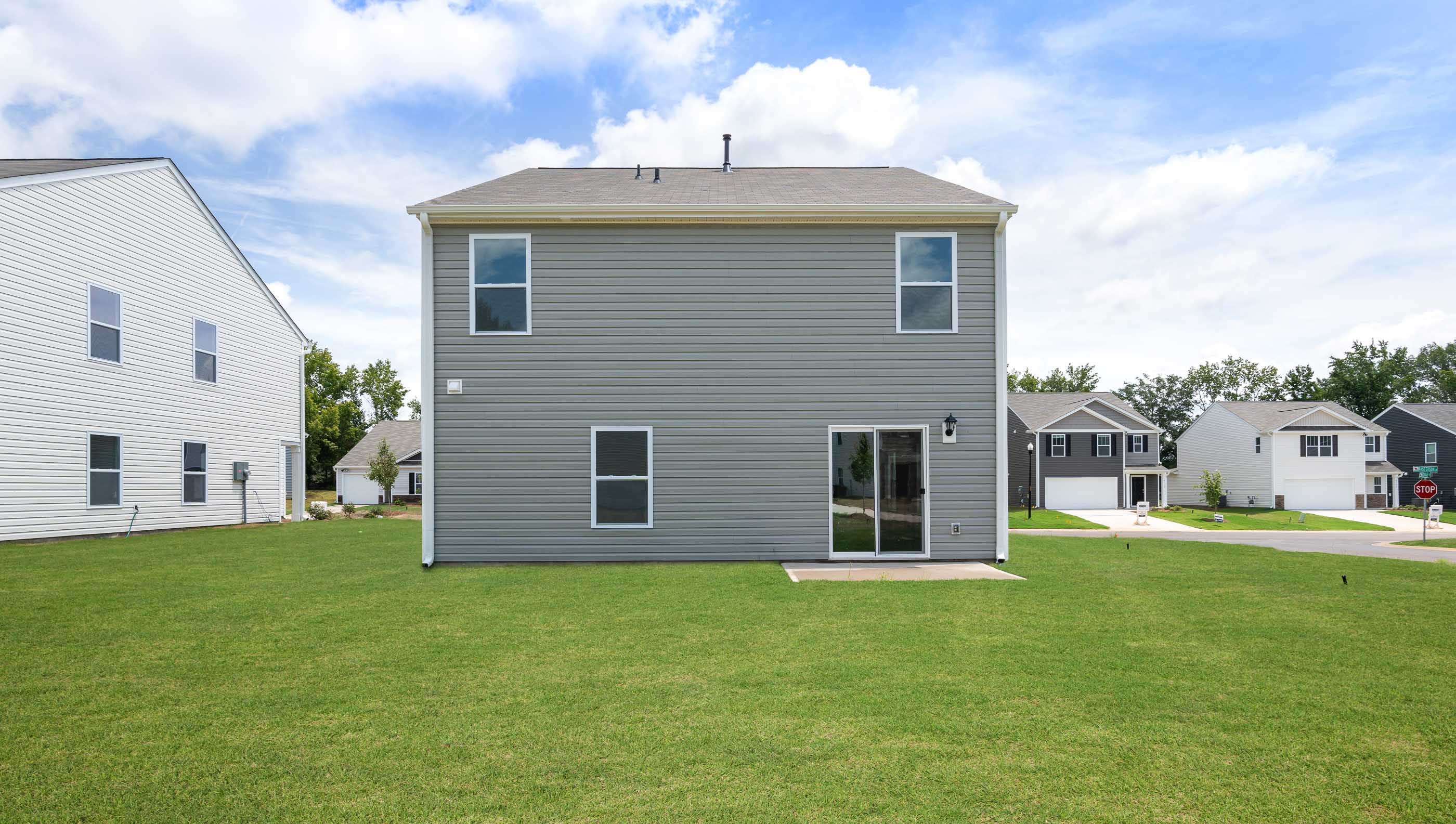 Back exterior with patio.