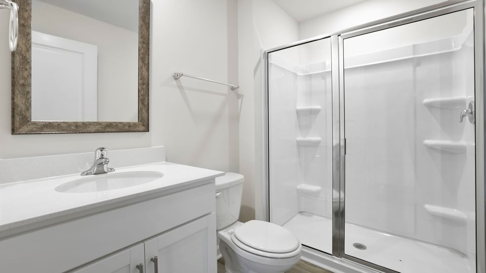Bathroom with single vanity sink and shower.