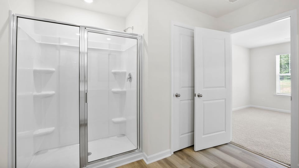 Bathroom with walk in shower.