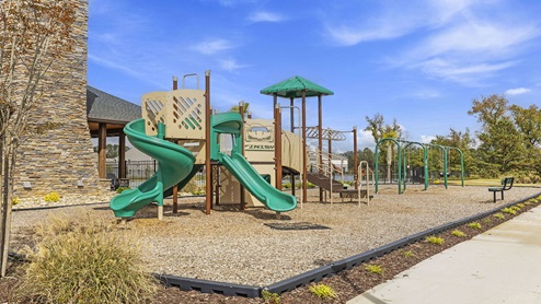 Playground with slide at amenity center.