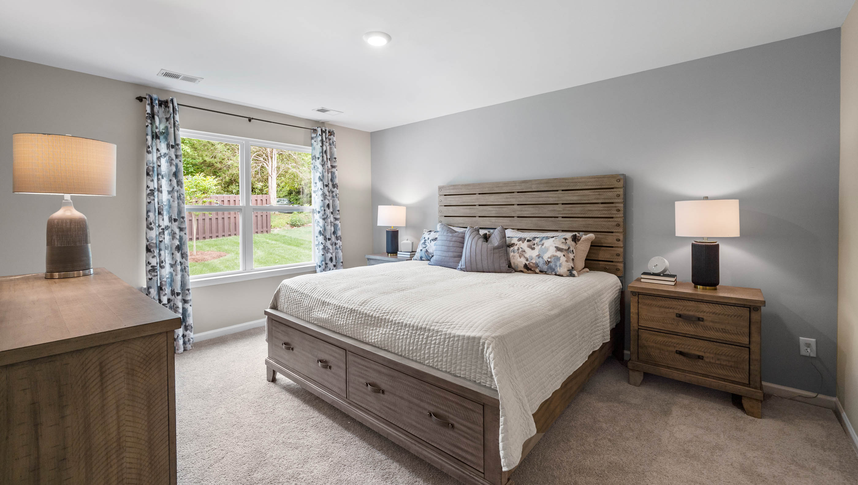 Bedroom with carpet and window.