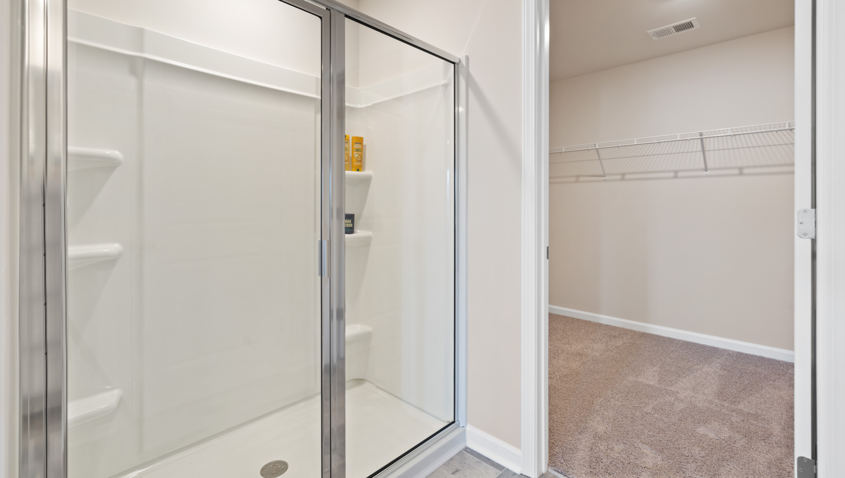 Bathroom with shower and closet.