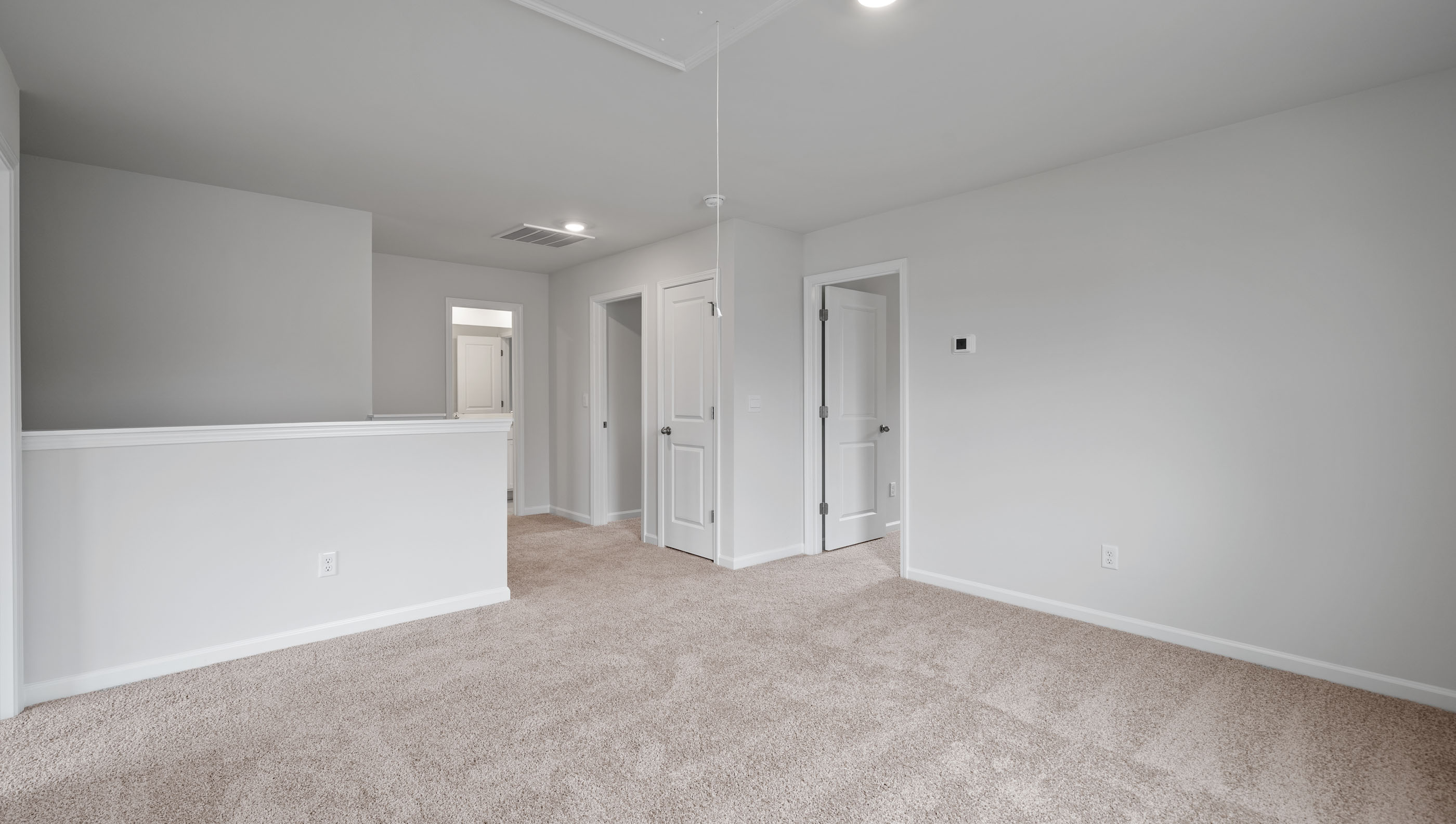 Loft area with carpet.