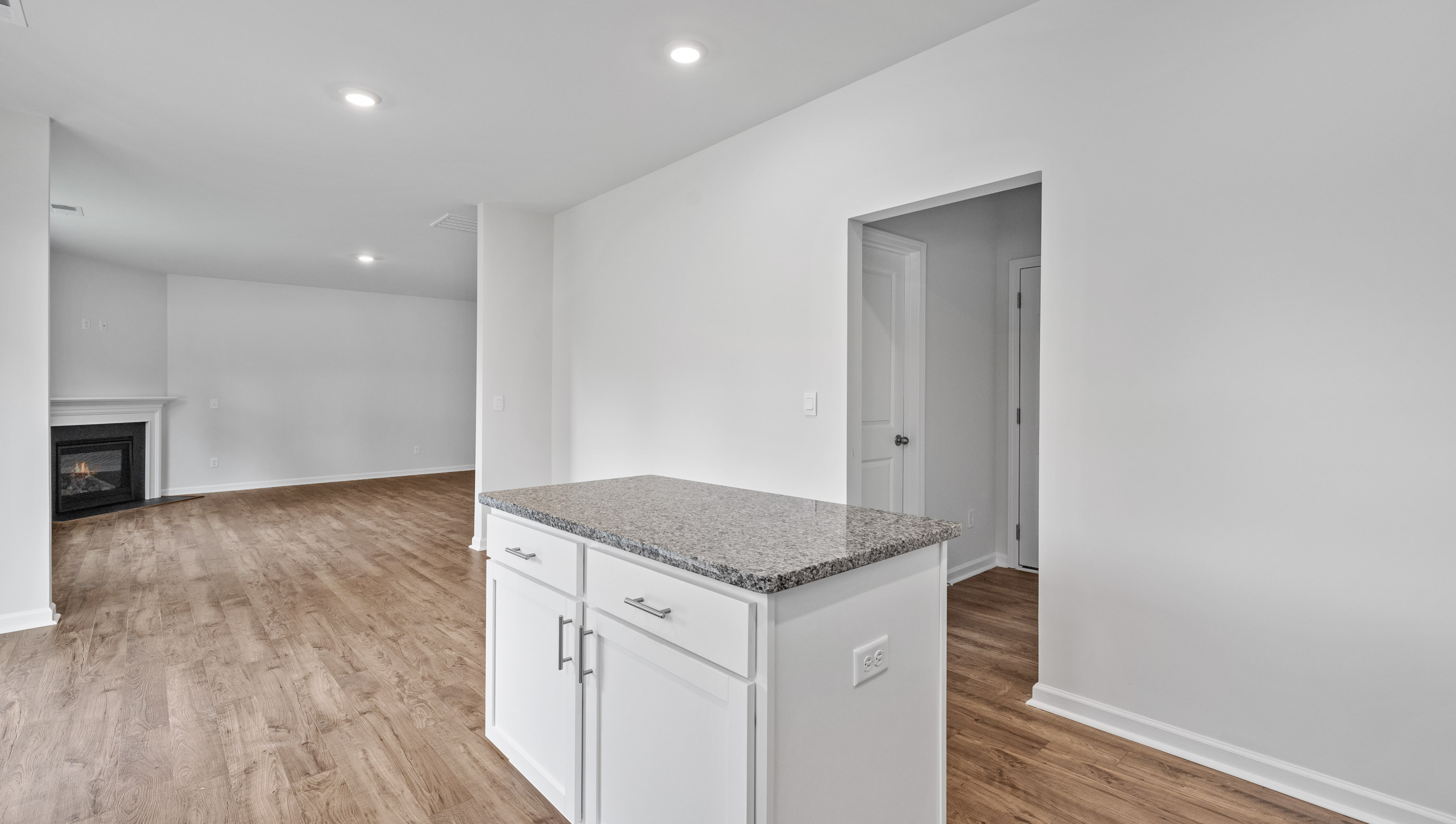 Kitchen and island with granite counter tops.