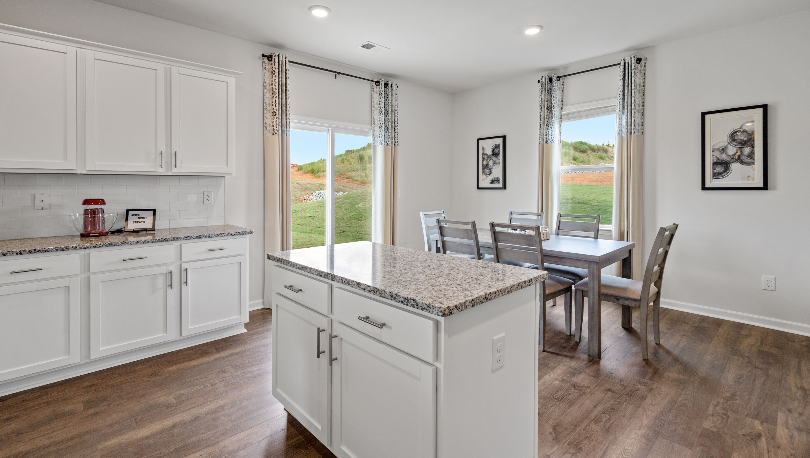 Kitchen and island with granite counter tops.