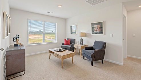 Loft area with carpet and window,