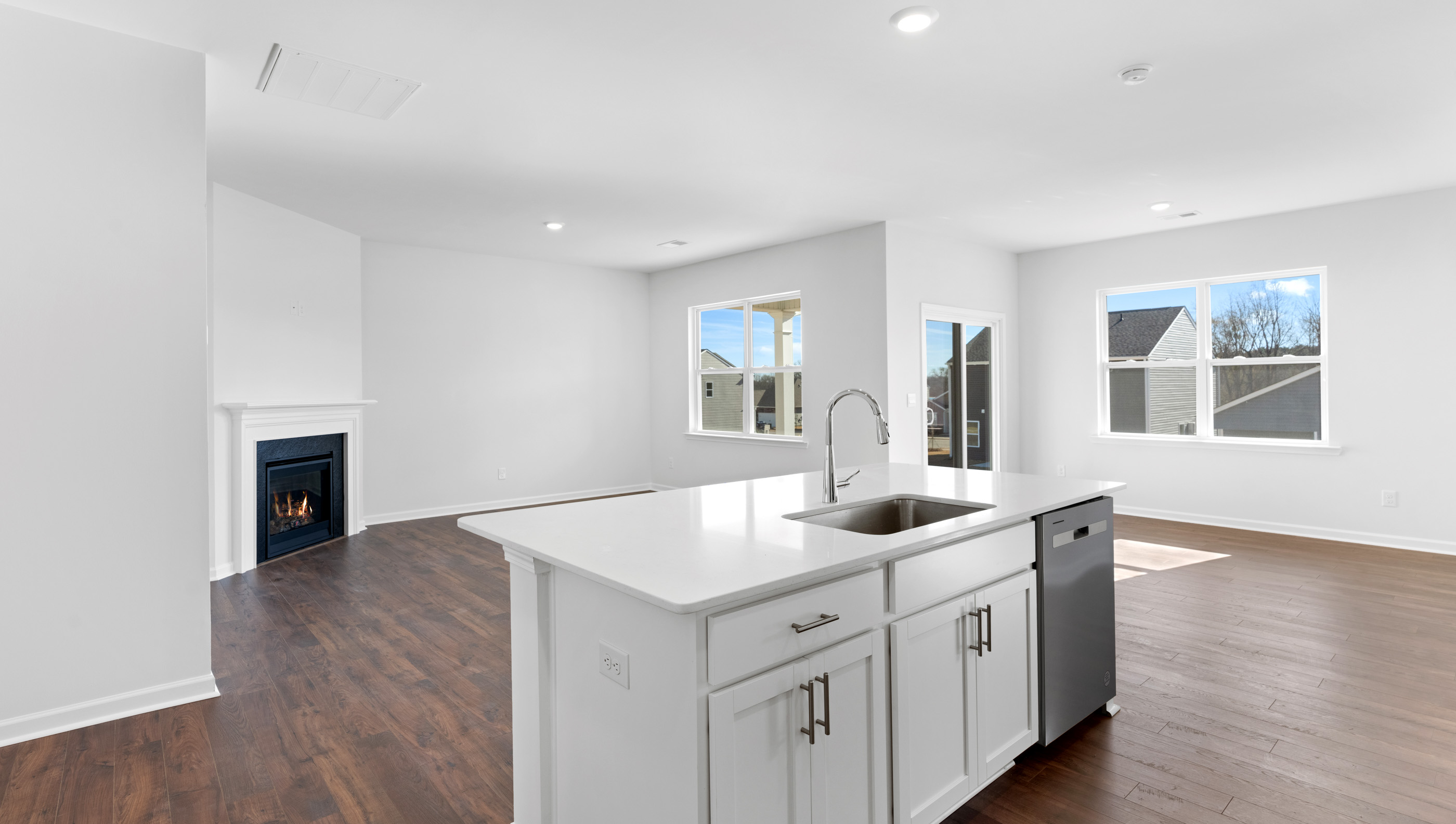 Kitchen and island with granite counter tops.