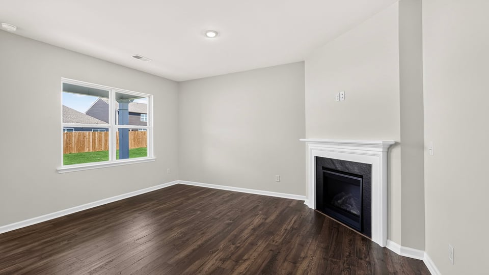 Living area with windows and fireplace.