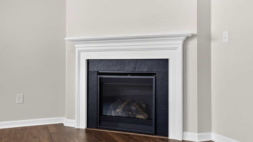 Living area with windows and fireplace.