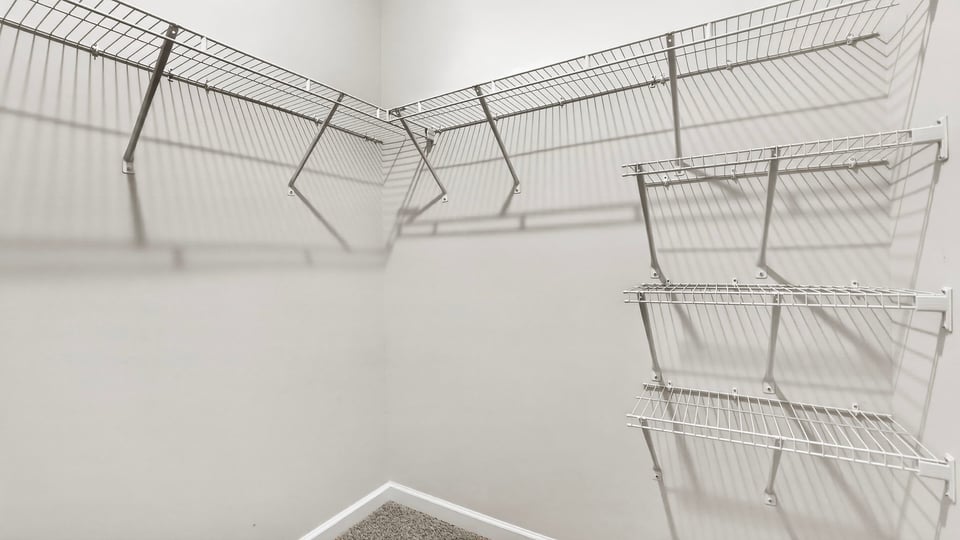 Primary closet with shelf/