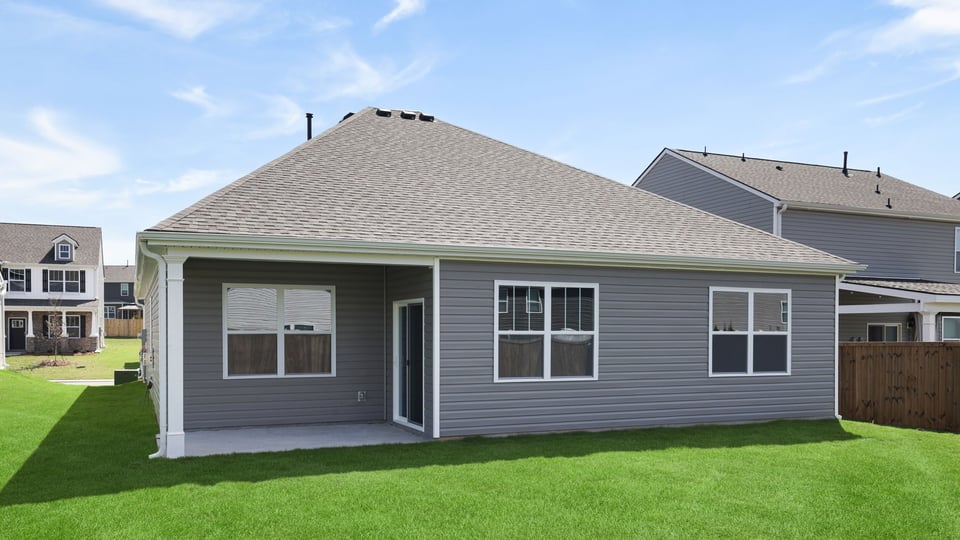 Back exterior with large backyard.