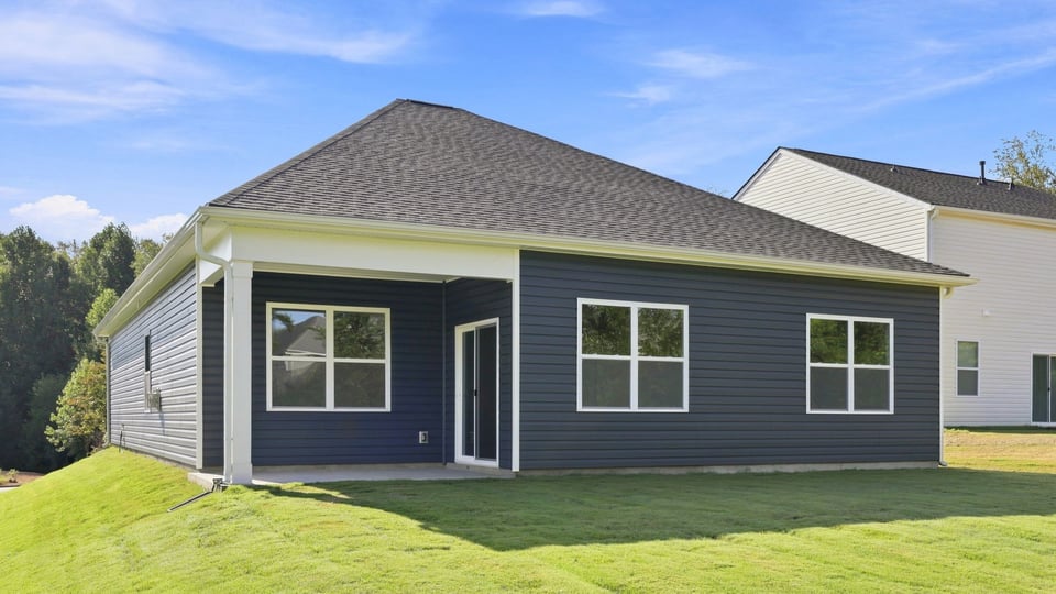 Back exterior with large backyard.