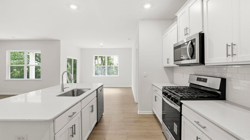Kitchen with island and cabinets.