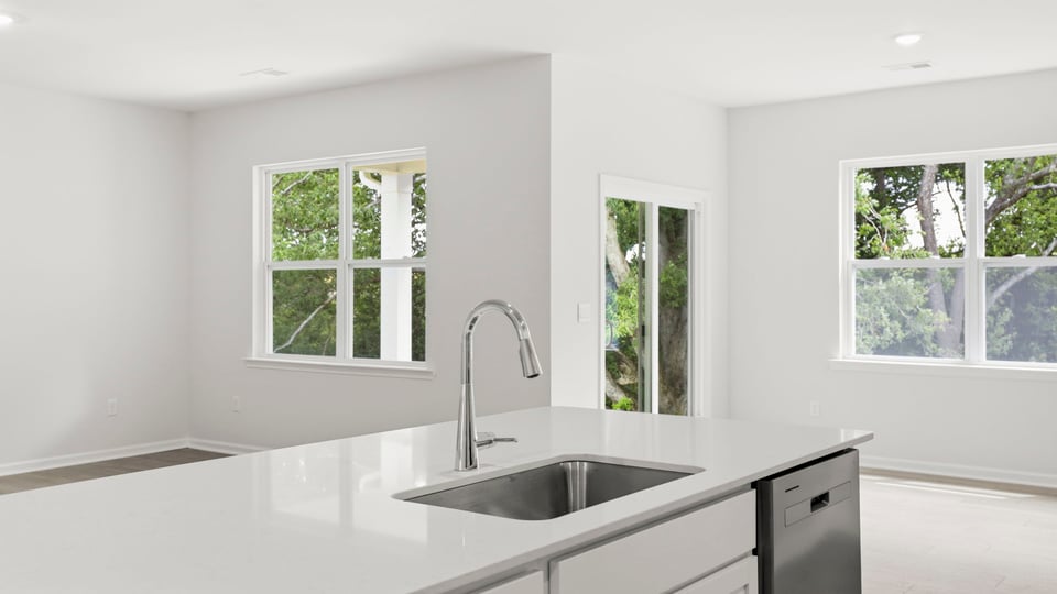 Kitchen with island and cabinets.