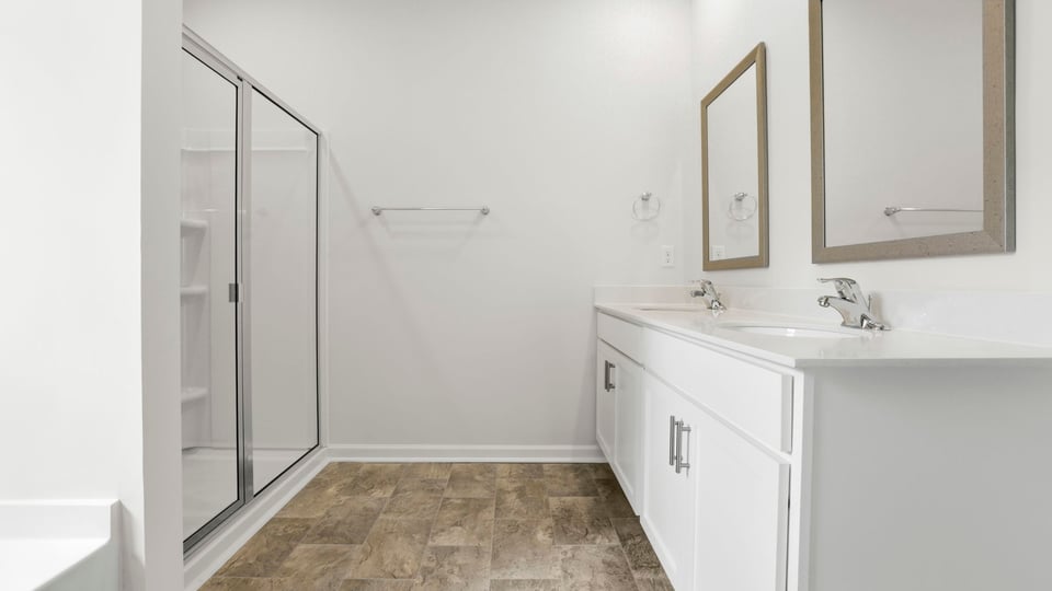 Primary bathroom with double vanity sinks.