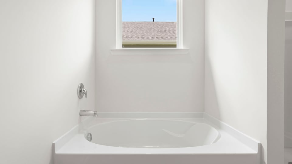 Primary bathroom with double vanity sinks.