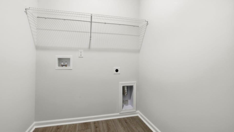 Laundry room with shelf.
