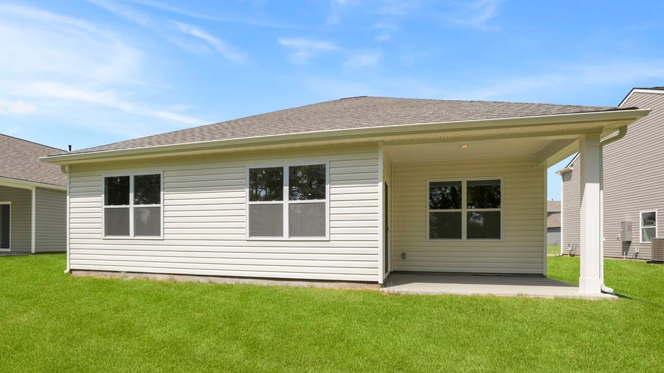 Back exterior with large backyard.