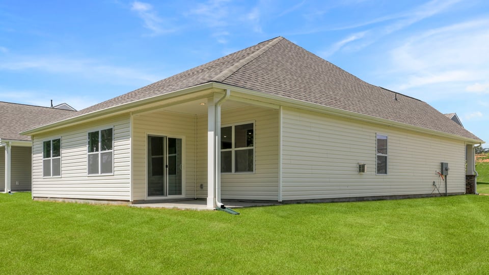 Back exterior with large backyard.