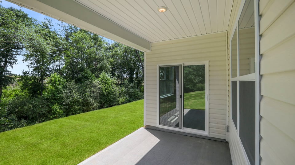 Back exterior with large backyard.