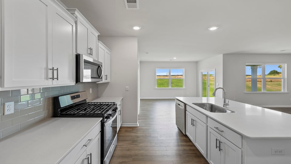 Kitchen with island and cabinets.