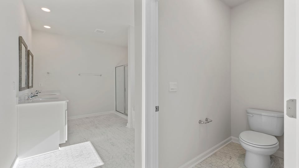 Primary bathroom with double vanity sinks.