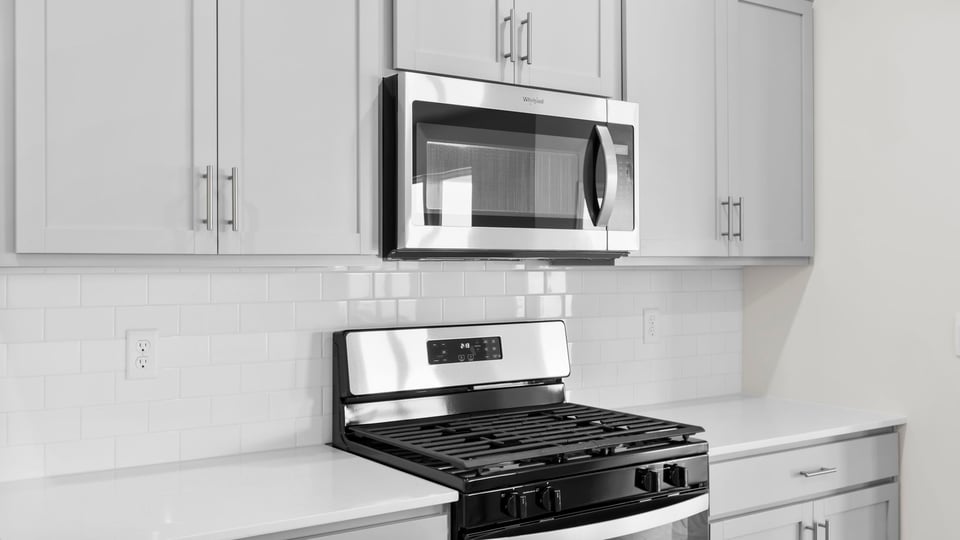 Kitchen with island and cabinets.
