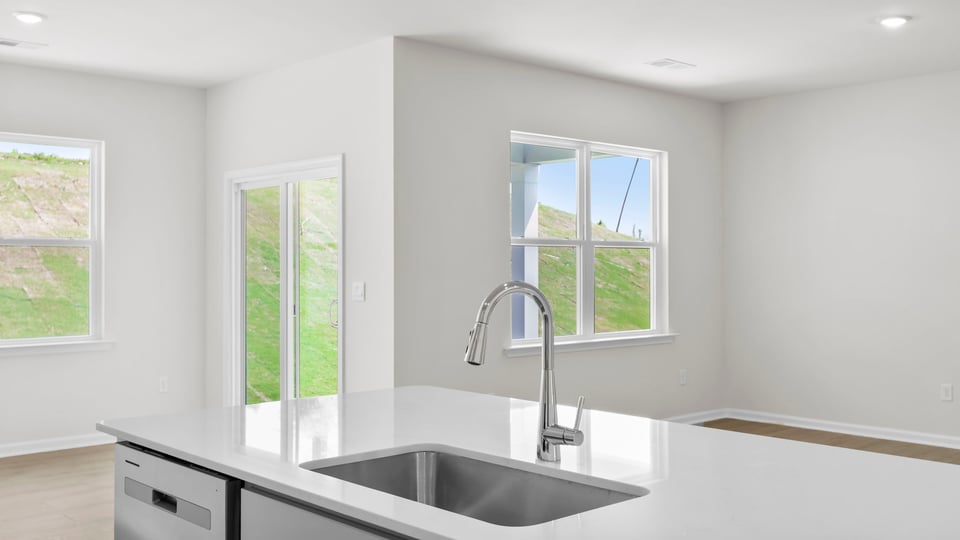 Kitchen with island and cabinets.
