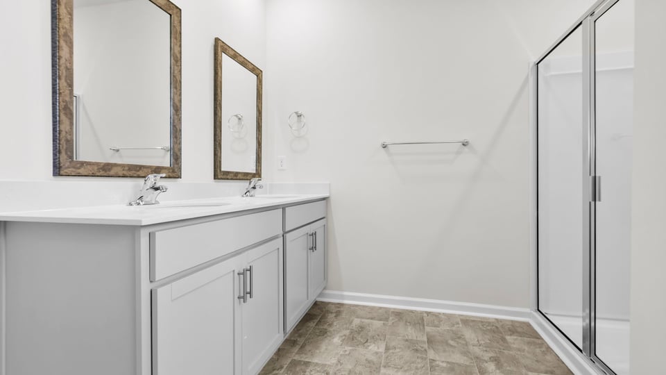 Primary bathroom with double vanity sinks.