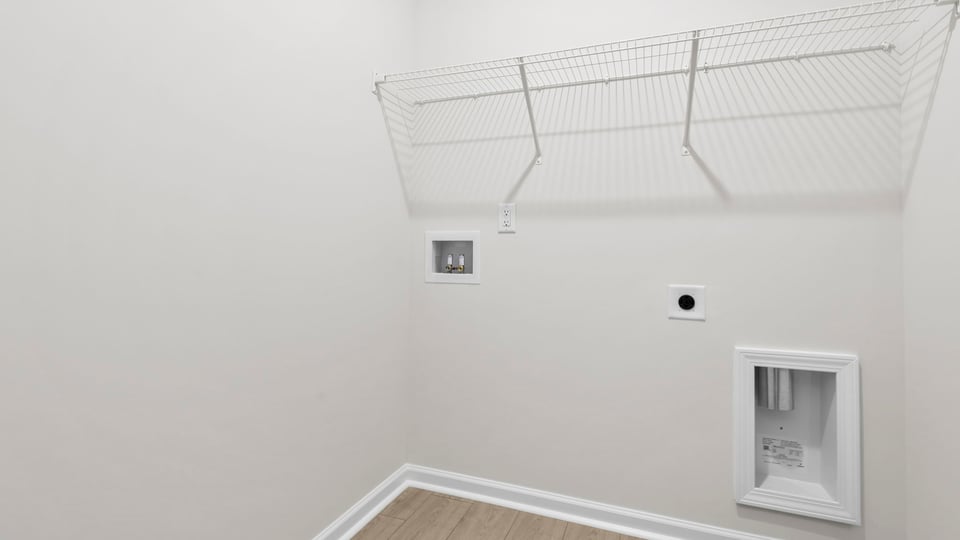 Laundry room with shelf.