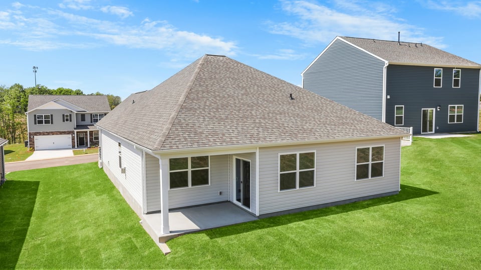 Back exterior with large backyard.