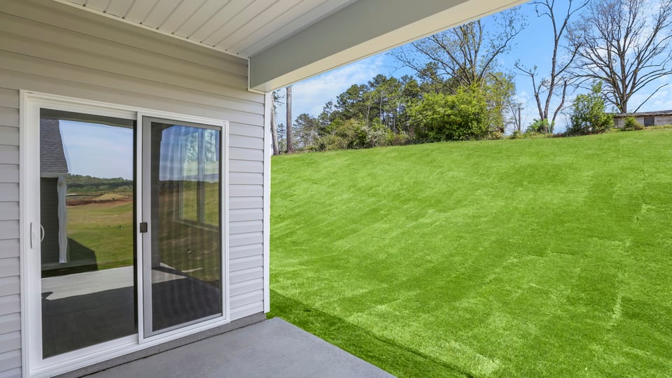 Back exterior with large backyard.