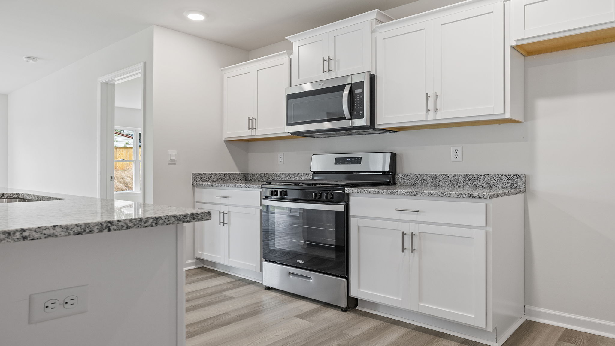 Kitchen features stainless steel appliances.