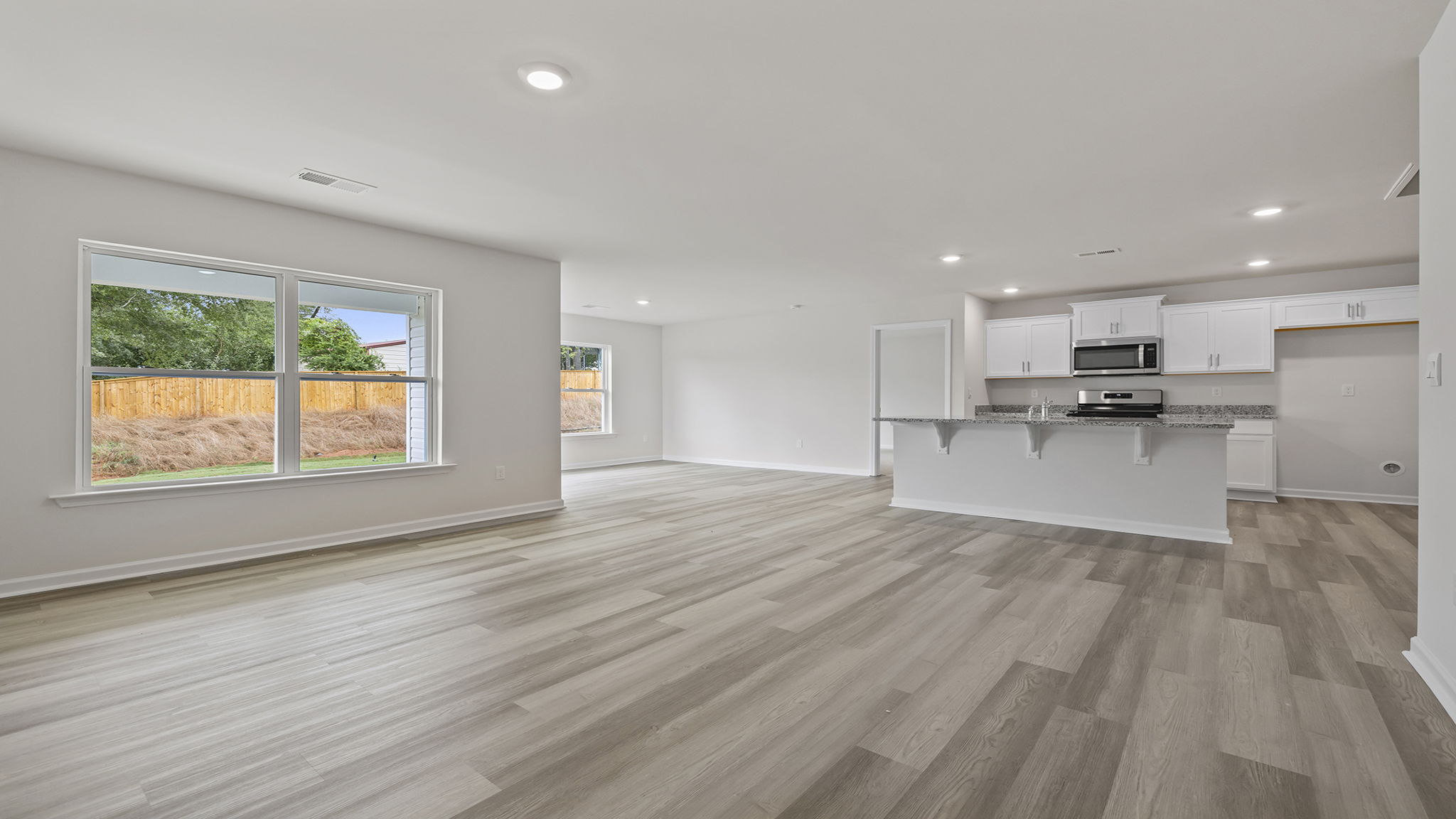 View from family room of the kitchen and dining area.