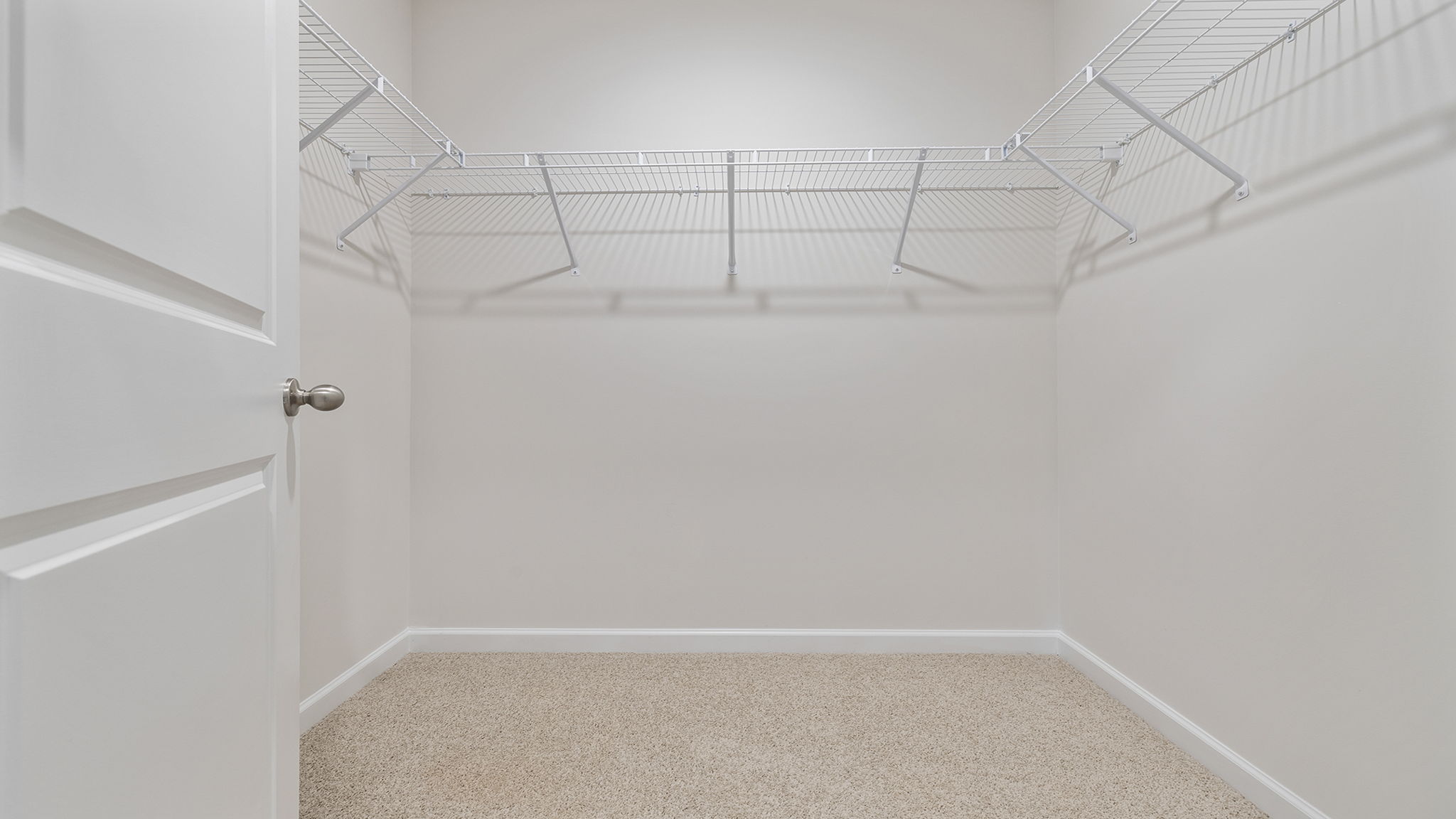 Primary bedroom walk in closet.
