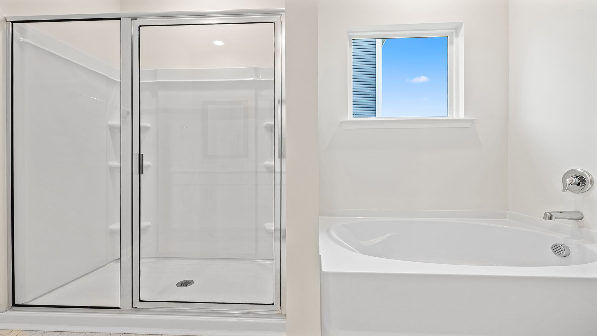 Primary bathroom has walk-in shower and garden tub.