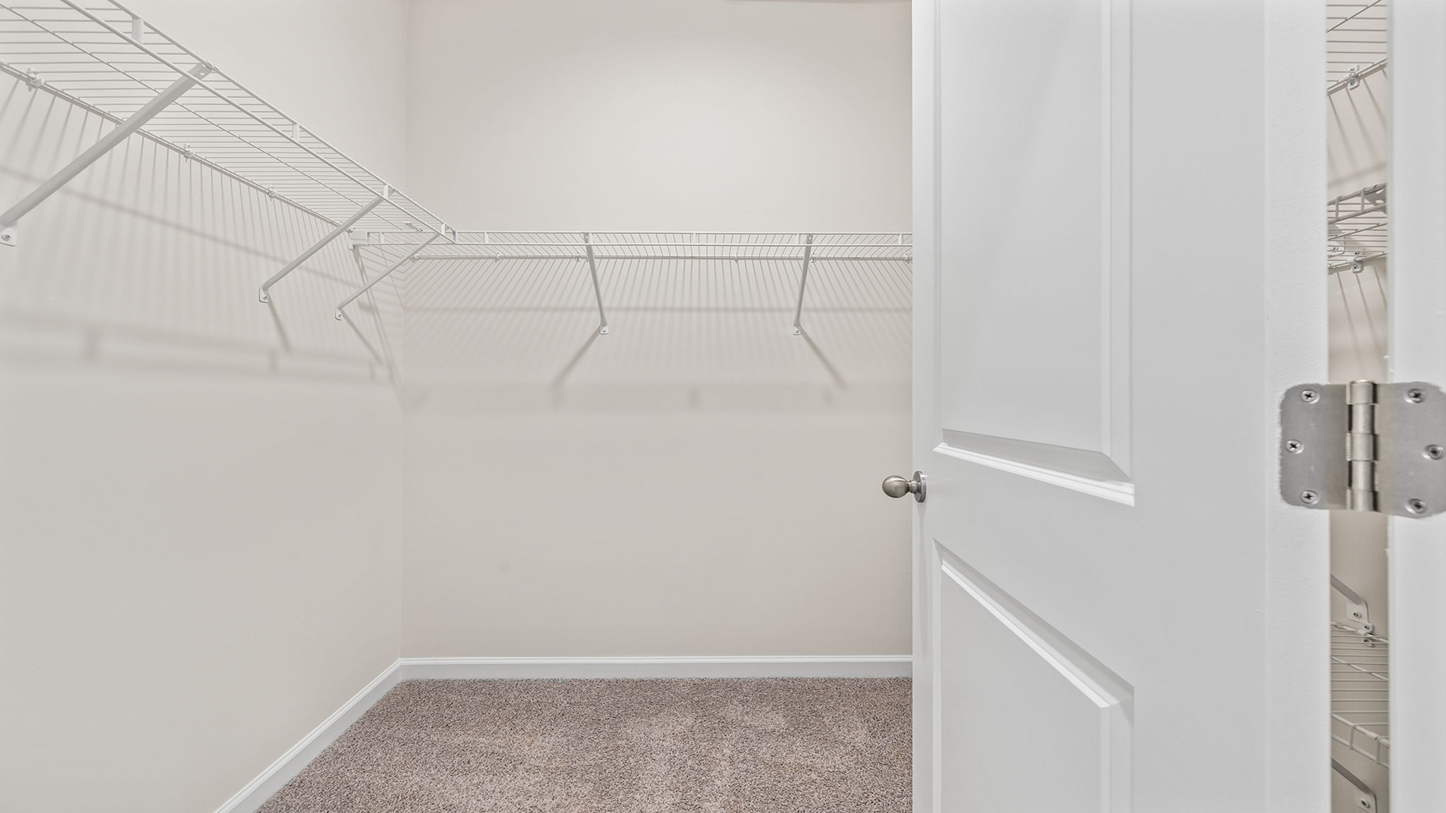 Primary bedroom walk-in closet.