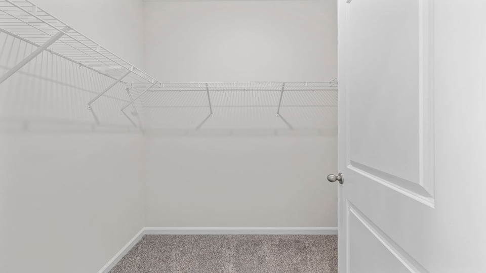 Primary bedroom walk-in closet.