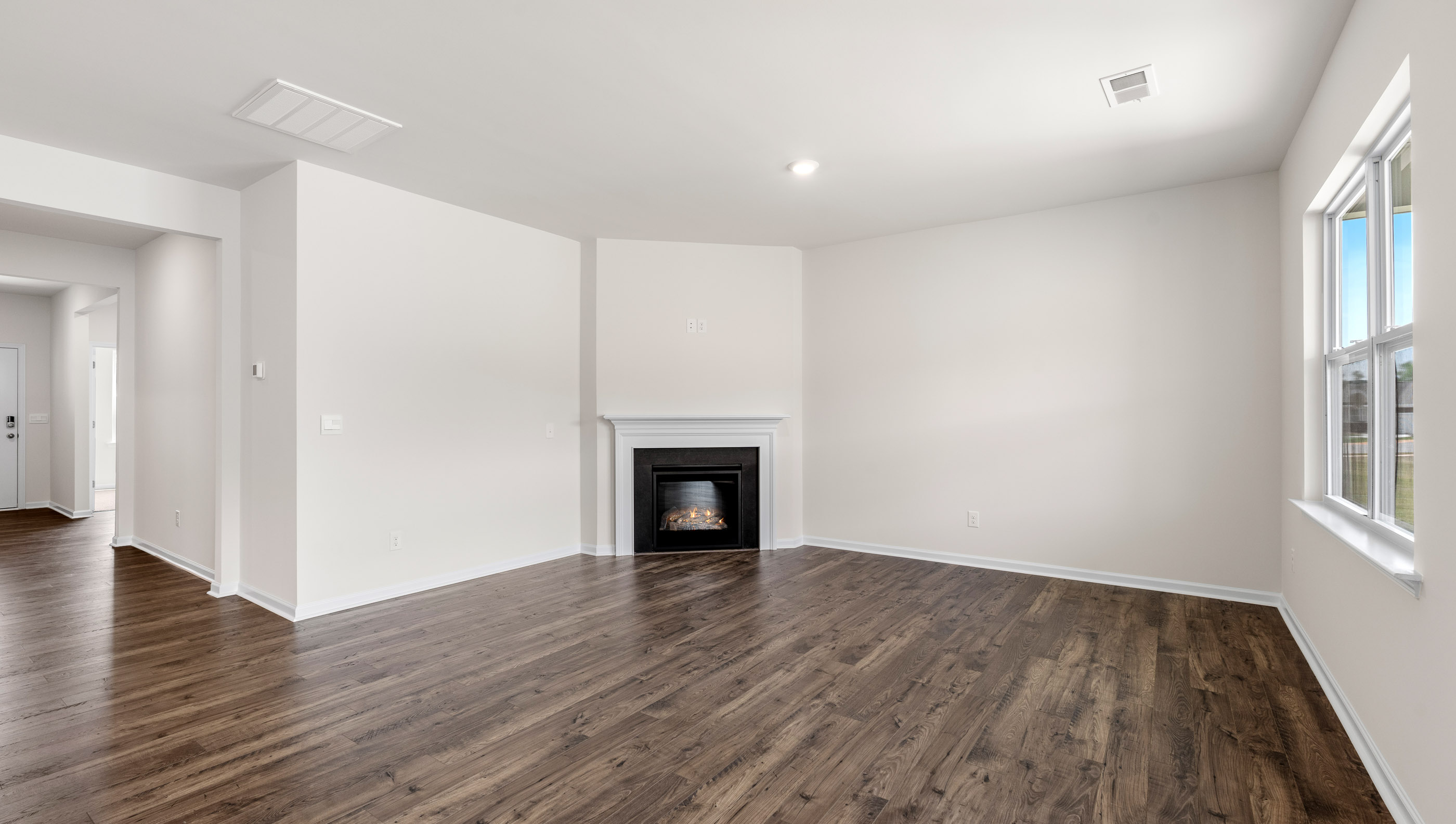 Livingroom with fireplace and window.