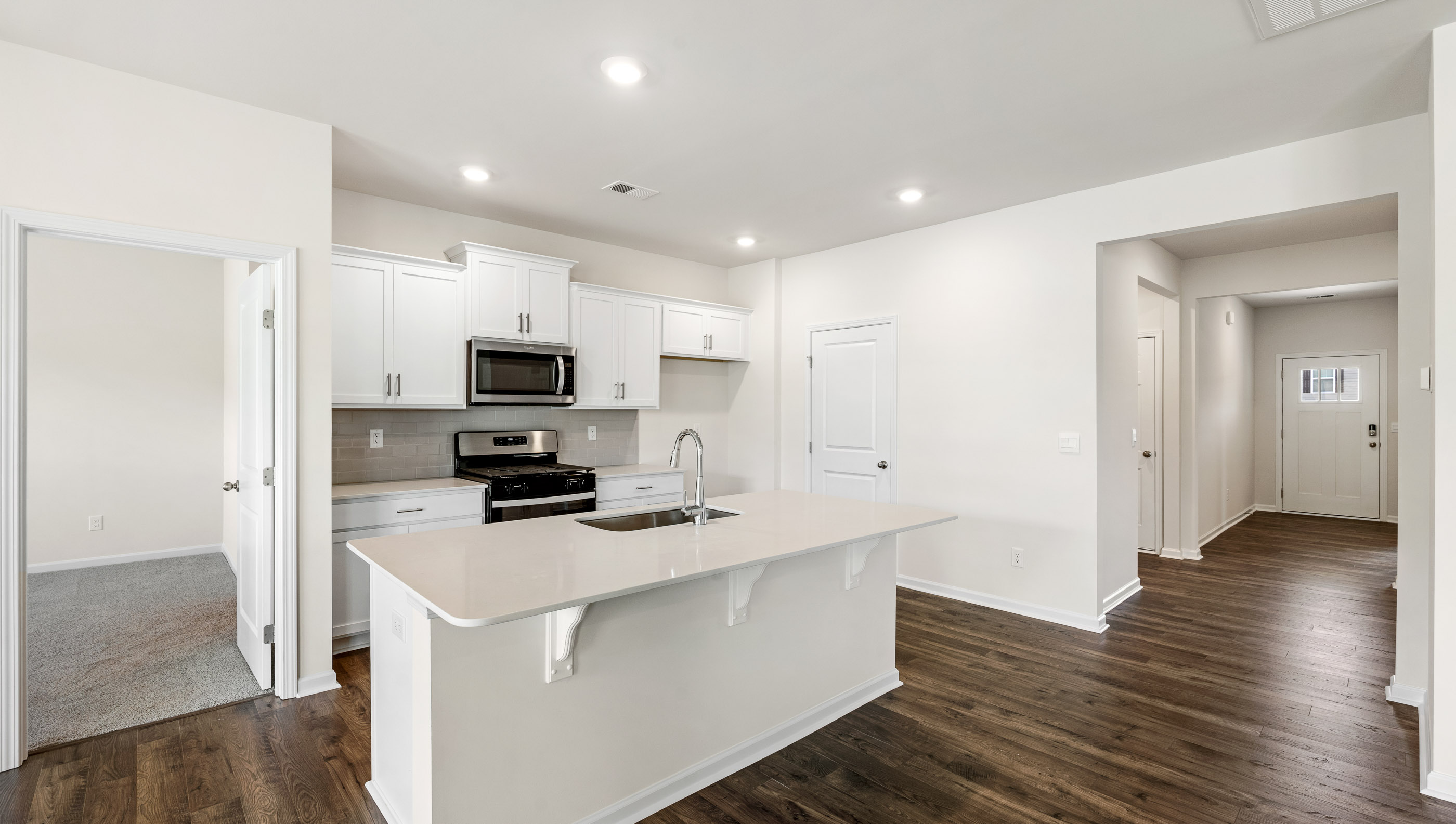 Kitchen with quartz countertop.