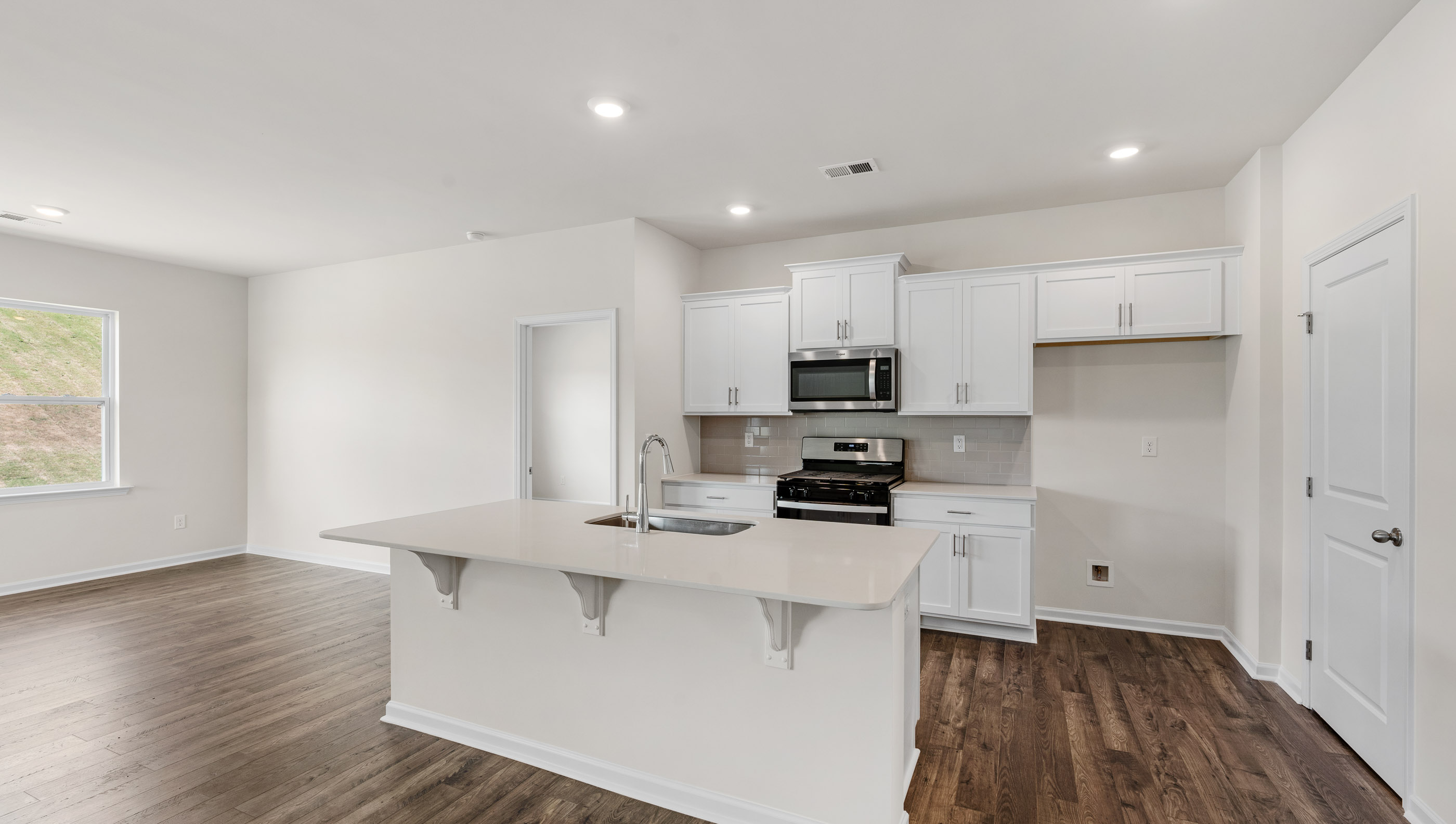 Kitchen with quartz countertop.