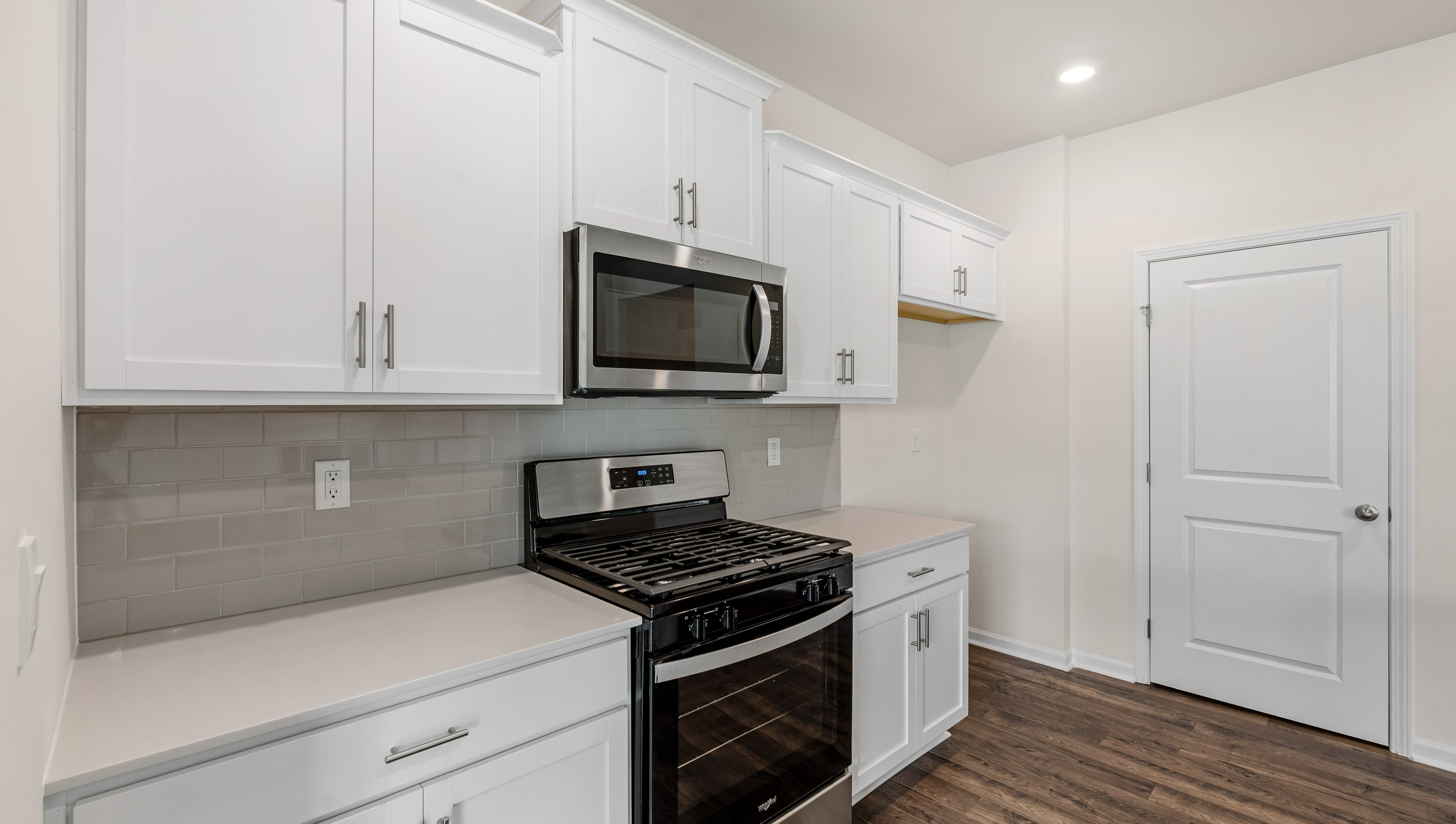 Kitchen with quartz countertop.