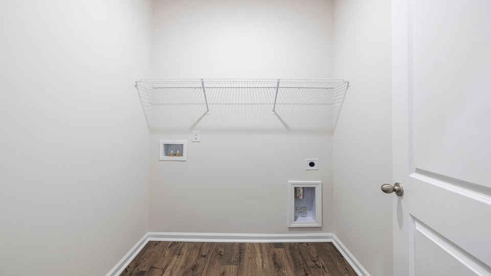 Laundry room with shelving.