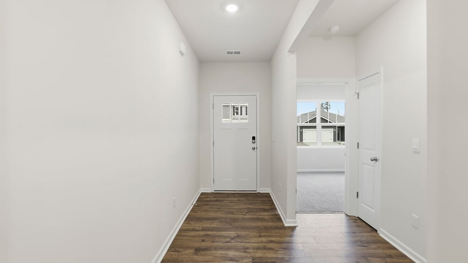 View of entrance and front bedroom entry.