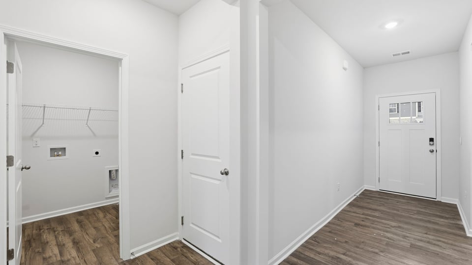 View of entrance and laundry room placement.