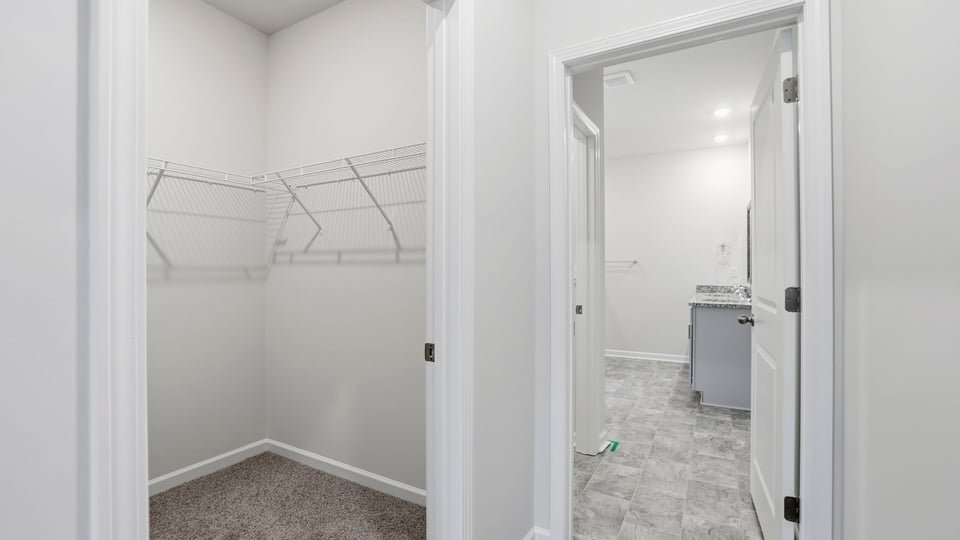 Primary bedroom walk-in closet.