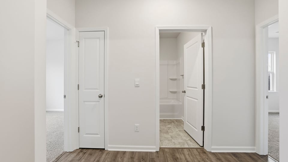 Entry way into home with view of rooms.